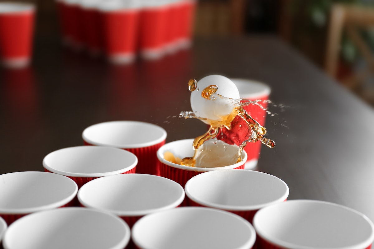 https://insurancejournal.imgix.net/2022/09/beer-pong-reduced-size.jpg?w=1200&h=800
